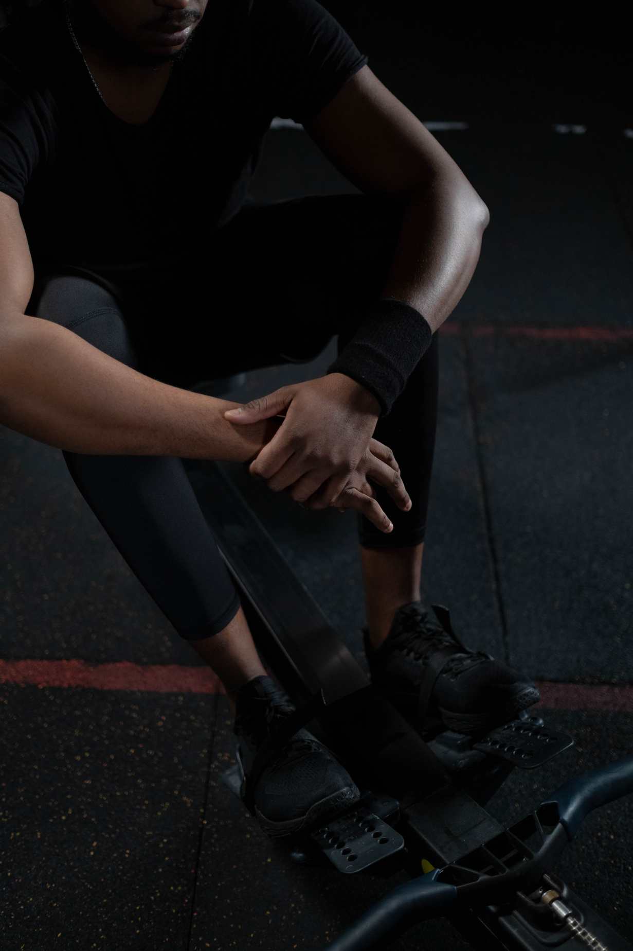 A Man in Black Activewear Resting